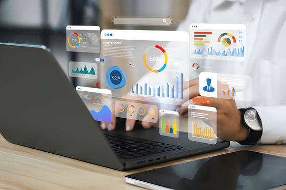 Advertising analytics charts floating above a laptop
