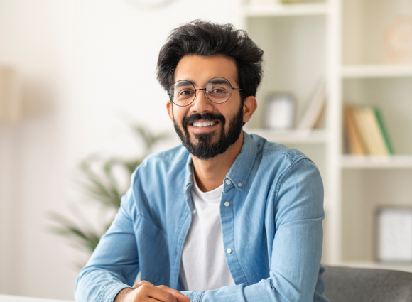 Smiling marketing consultant in a denim shirt