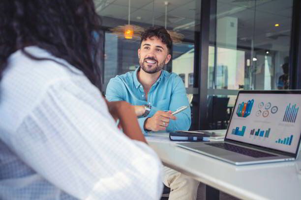 Marketing consultant reviewing a campaign plan with a client